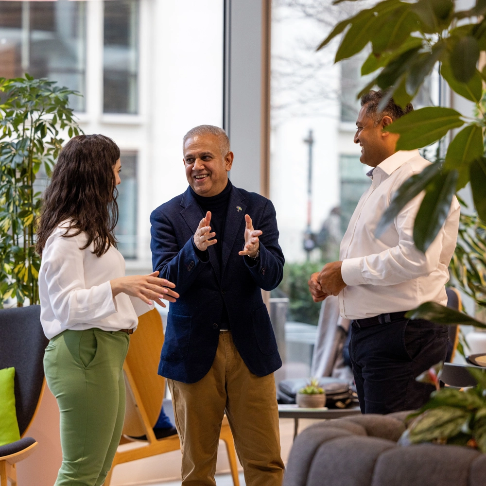 Three employees stand in the reception area of L&G's 1 Coleman Street office in London, England. Three employees stand in the reception area of L&G's 1 Coleman Street office in London, England.