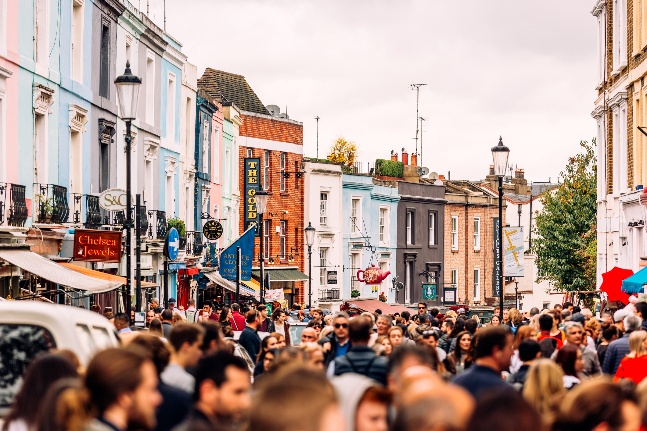 Crowded street at Portobello Road Market in Notting Hill, London, UK.