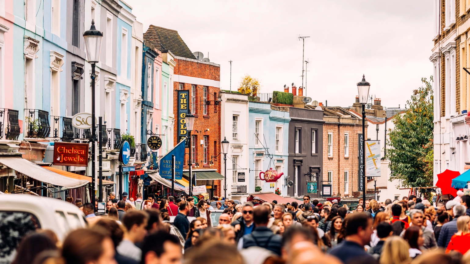 Crowded street at Portobello Road Market in Notting Hill, London, UK. Crowded street at Portobello Road Market in Notting Hill, London, UK.