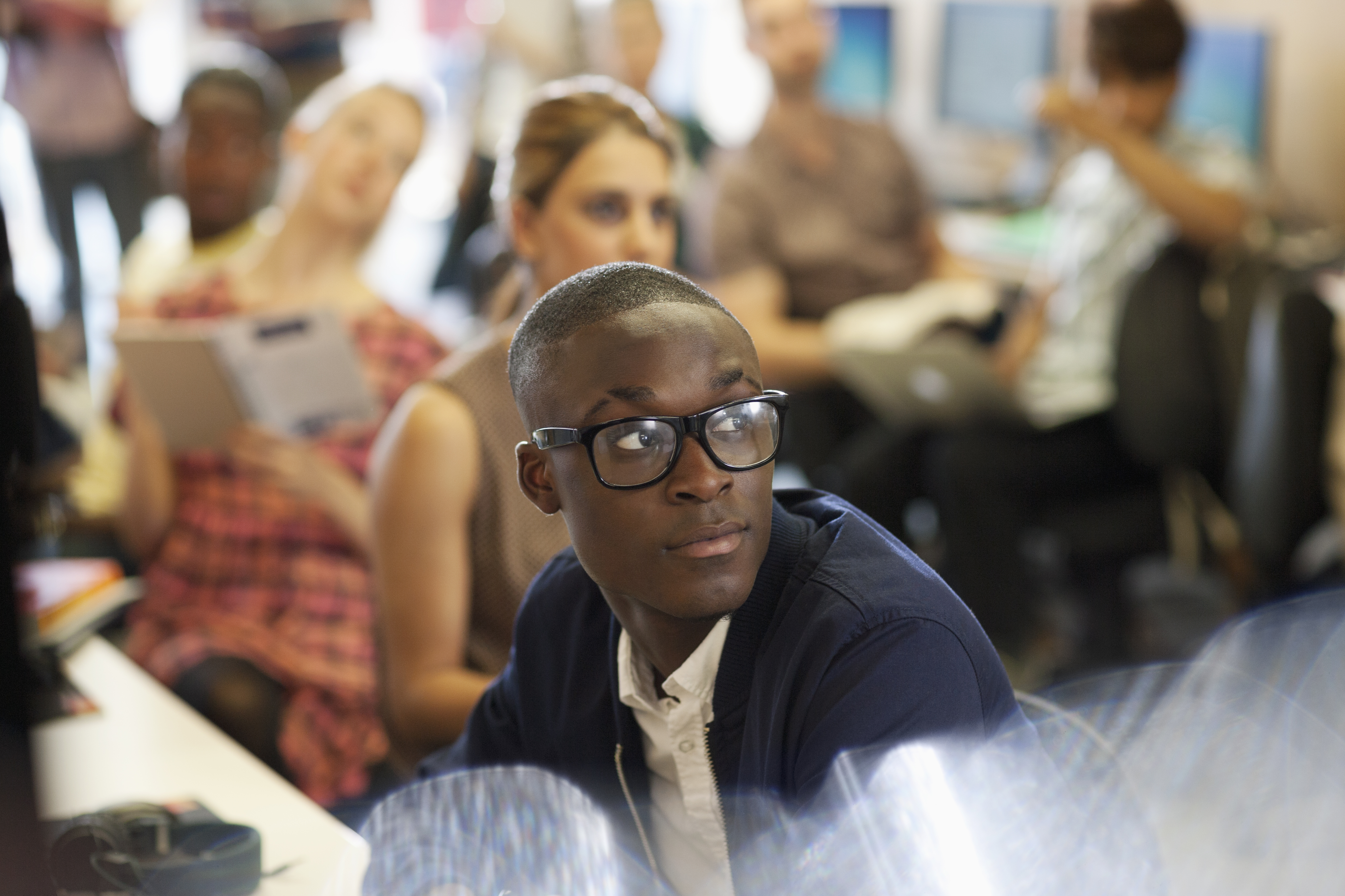 Young man listening in a class 