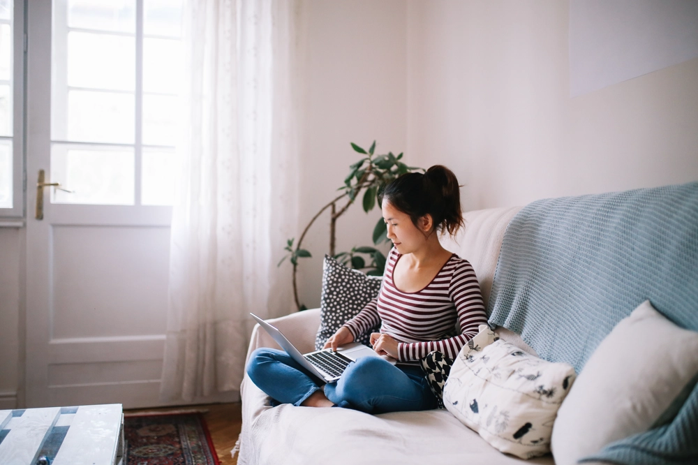 Womanonsofawithlaptop (1) Womanonsofawithlaptop (1)